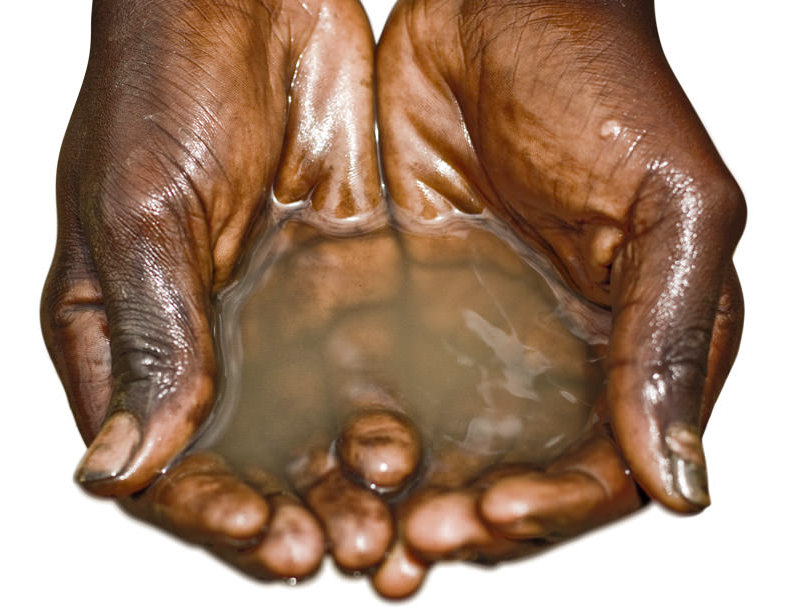 A boy's hands cupping water