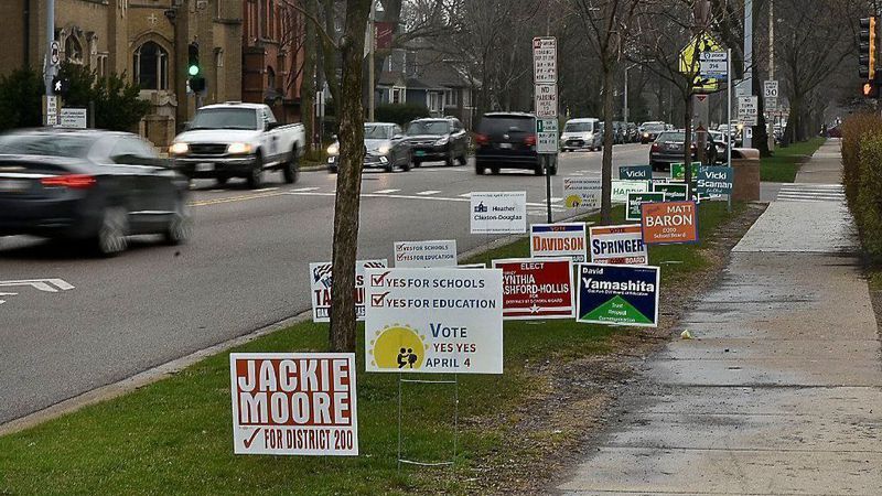 name recognition yard signs on a street